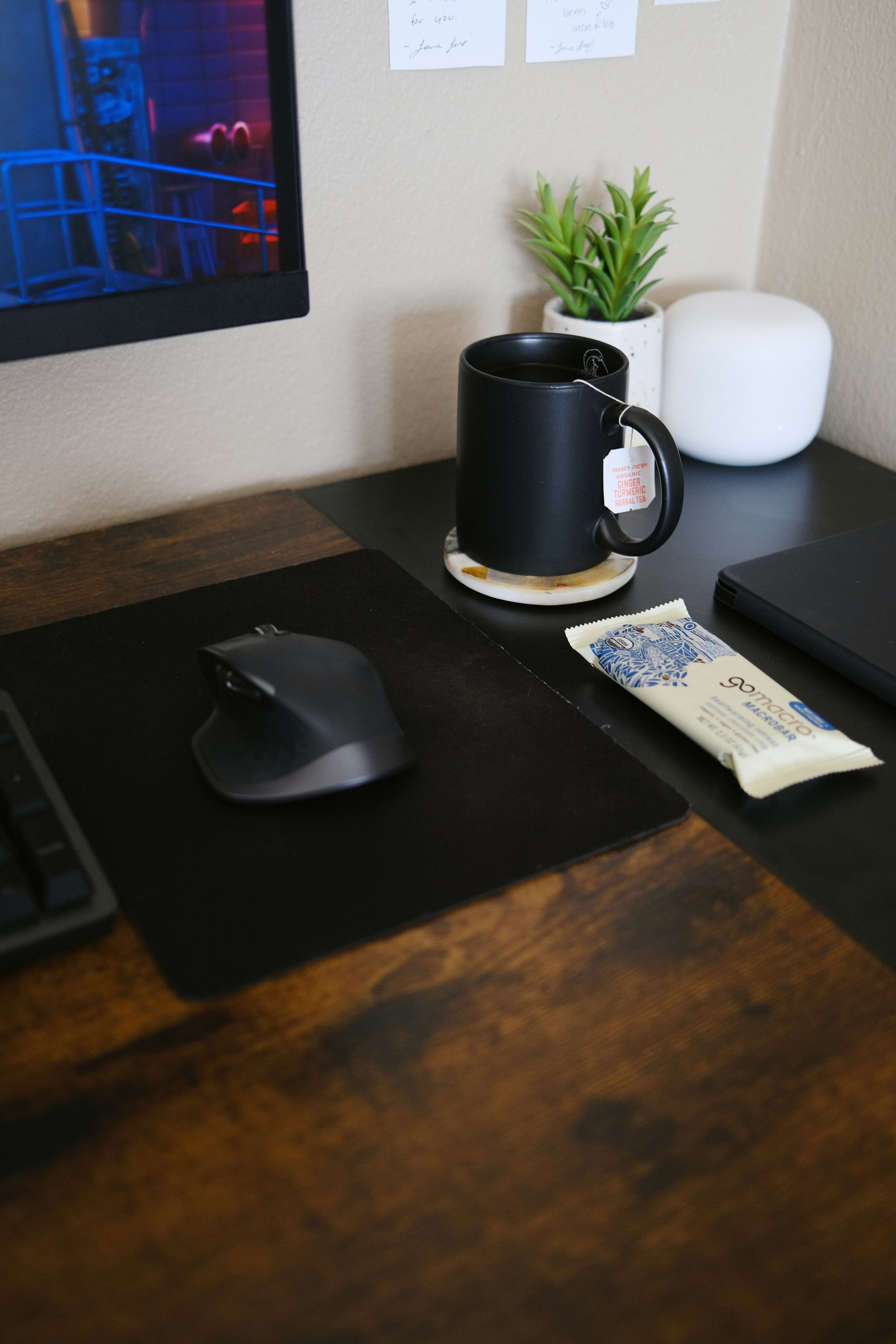 black and silver cordless computer mouse beside black laptop computer